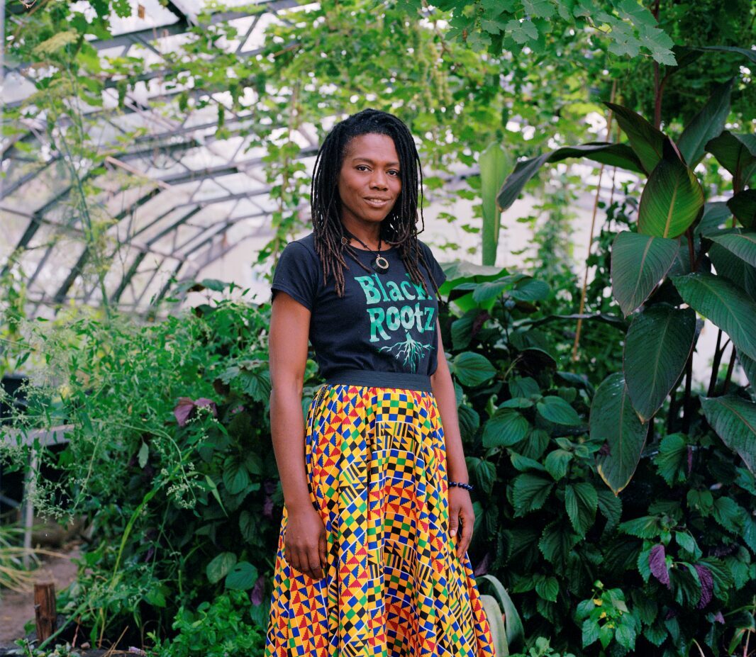 Pamela Shor of Black Roots food growing initiative in the produce greenhouse